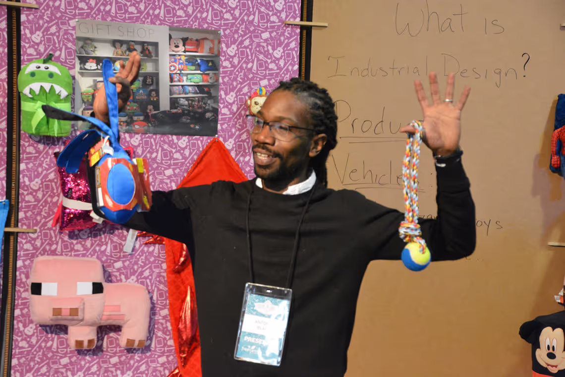 A man in a black shirt and some toys